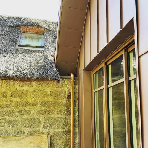 Réalisation d'une extension avec pose d'un bardage en zinc