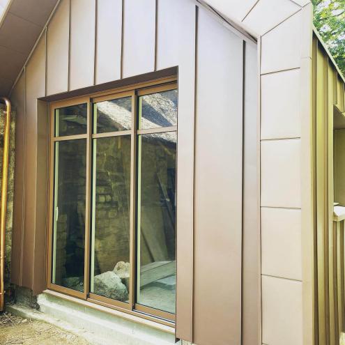 Réalisation d'une extension avec pose d'un bardage en zinc